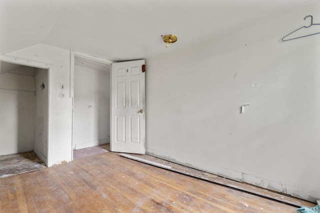212 Prospect St, Norwich, CT 06360 - unfurnished bedroom with wood finished floors and vaulted ceiling