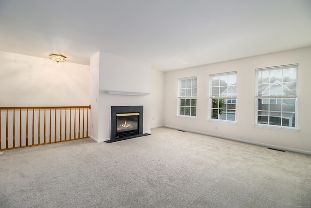 2303 Eaton Ct Unit 2303, Danbury, CT 06811 - unfurnished living room featuring carpet and a fireplace with flush hearth