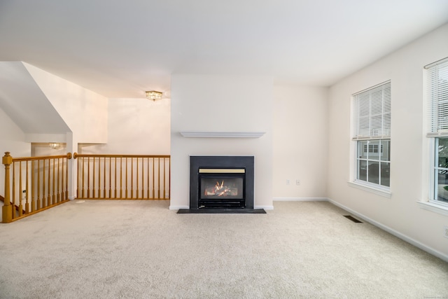 2303 Eaton Ct Unit 2303, Danbury, CT 06811 - unfurnished living room with carpet floors and a fireplace with flush hearth