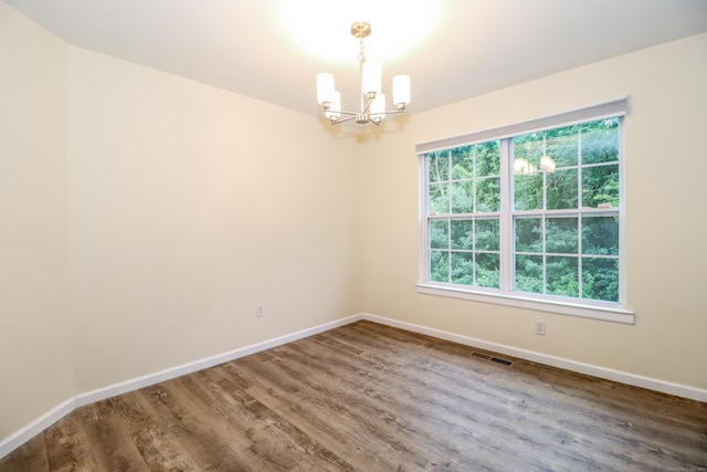2303 Eaton Ct Unit 2303, Danbury, CT 06811 - empty room featuring a chandelier and wood finished floors