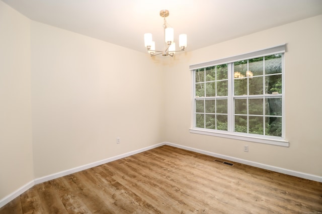 2303 Eaton Ct Unit 2303, Danbury, CT 06811 - unfurnished room featuring a chandelier and wood finished floors