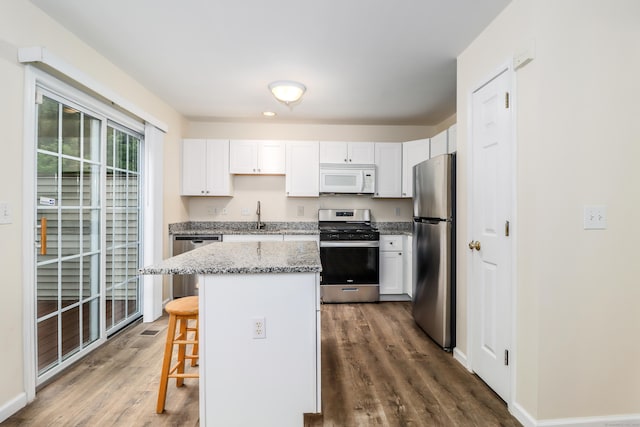 2303 Eaton Ct Unit 2303, Danbury, CT 06811 - kitchen featuring appliances with stainless steel finishes, dark wood-style floors, and white cabinets
