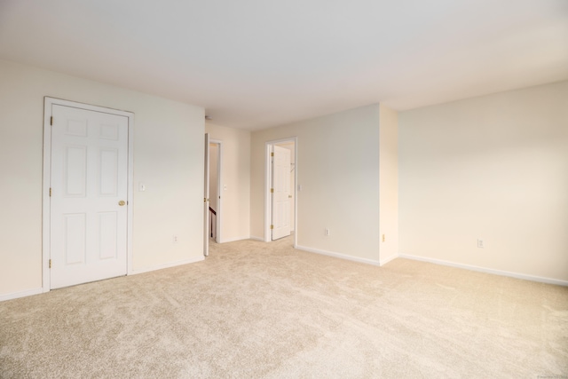 2303 Eaton Ct Unit 2303, Danbury, CT 06811 - unfurnished bedroom with light colored carpet and baseboards