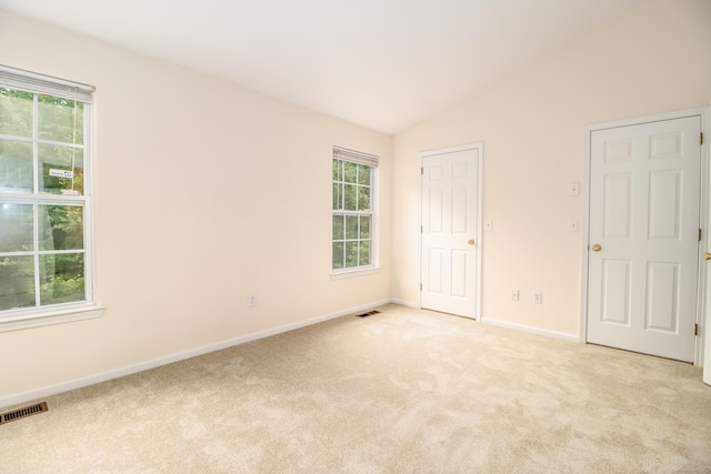 2303 Eaton Ct Unit 2303, Danbury, CT 06811 - unfurnished bedroom with carpet flooring, multiple windows, and lofted ceiling