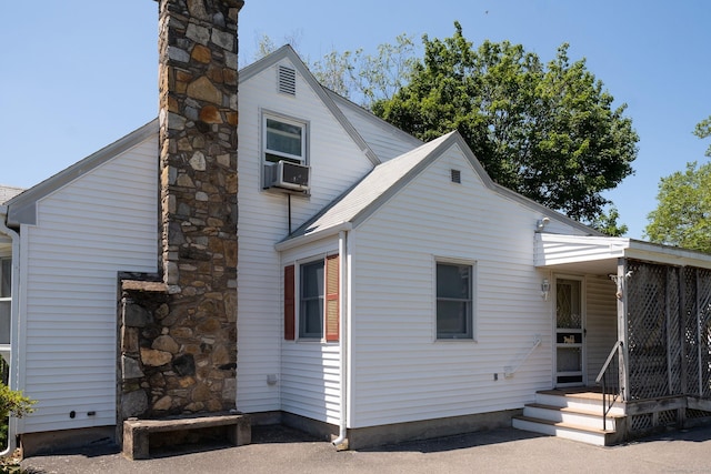 56 Franklin St, Vernon, CT 06066 - view of front of property featuring a chimney and cooling unit