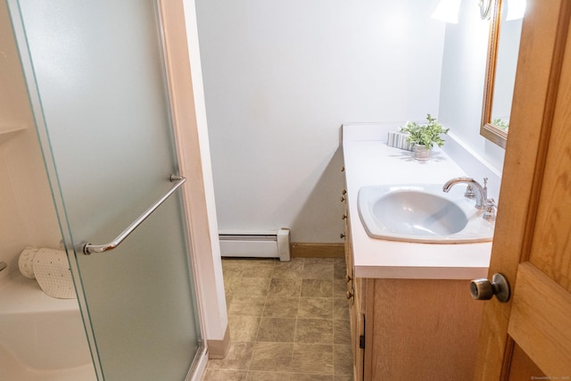 56 Franklin St, Vernon, CT 06066 - bathroom featuring baseboard heating, vanity, and a stall shower