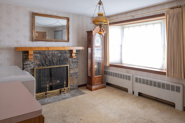 56 Franklin St, Vernon, CT 06066 - unfurnished living room with wallpapered walls, radiator, carpet floors, and a fireplace