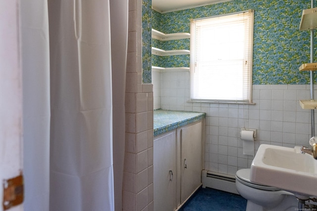 56 Franklin St, Vernon, CT 06066 - bathroom with a baseboard heating unit, wallpapered walls, tile walls, a shower with curtain, and crown molding