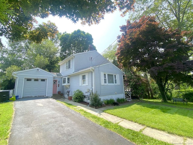 50 Howe St, Milford, CT 06460 - view of front of home with a front yard, asphalt driveway, a garage, and entry steps