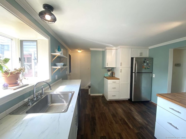 50 Howe St, Milford, CT 06460 - kitchen featuring freestanding refrigerator, white cabinetry, dark wood-type flooring, butcher block counters, and crown molding