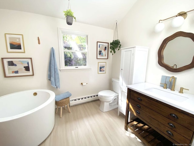 50 Howe St, Milford, CT 06460 - bathroom with a baseboard radiator, vanity, a soaking tub, wood finished floors, and lofted ceiling