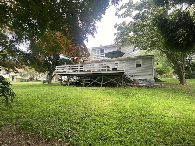 50 Howe St, Milford, CT 06460 - back of property with a wooden deck and a yard