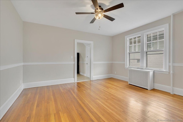 219 Jordan Ln, Wethersfield, CT 06109 - unfurnished room with radiator, a ceiling fan, and light wood-style floors