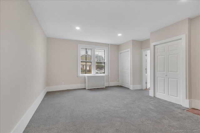 219 Jordan Ln, Wethersfield, CT 06109 - unfurnished bedroom with radiator, carpet, and recessed lighting