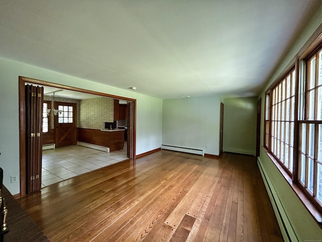 364 Locust Rd, Harwinton, CT 06791 - unfurnished living room featuring a baseboard radiator, hardwood / wood-style floors, and baseboard heating