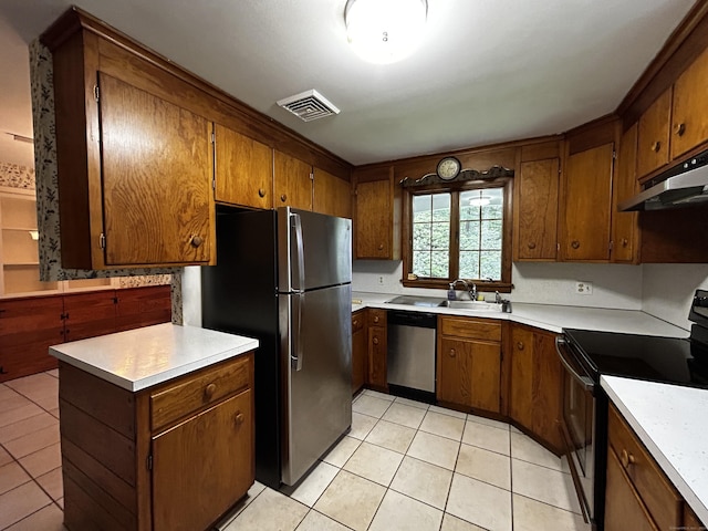 364 Locust Rd, Harwinton, CT 06791 - kitchen featuring stainless steel appliances, under cabinet range hood, brown cabinetry, and light tile patterned floors