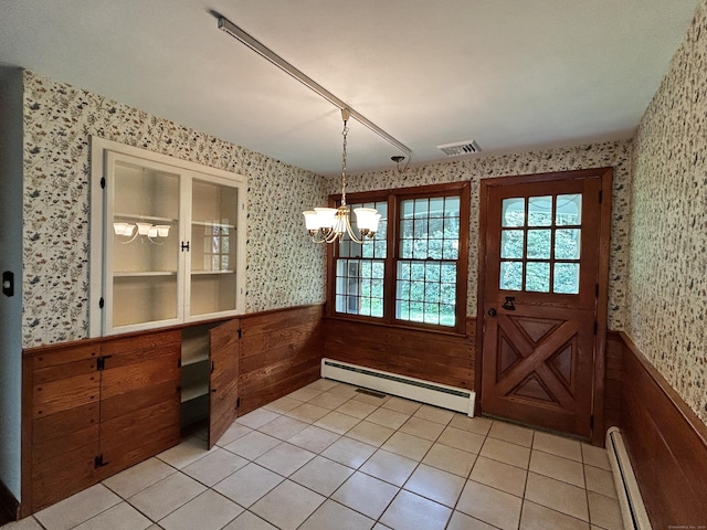 364 Locust Rd, Harwinton, CT 06791 - unfurnished dining area featuring a baseboard radiator, wallpapered walls, a wainscoted wall, a chandelier, and light tile patterned flooring