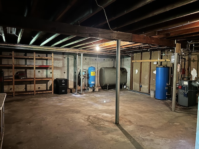 364 Locust Rd, Harwinton, CT 06791 - unfinished basement featuring gas water heater, heating fuel, a water pressure tank, and a heating unit