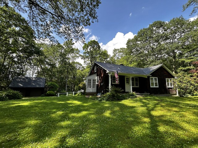 364 Locust Rd, Harwinton, CT 06791 - view of front of property with a front yard, french doors, and view of scattered trees