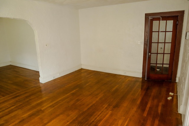 77 Beardsley Park Ter, Bridgeport, CT 06610 - unfurnished room with wood finished floors and arched walkways