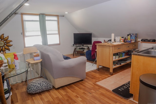 77 Beardsley Park Ter, Bridgeport, CT 06610 - living area with light wood finished floors and vaulted ceiling