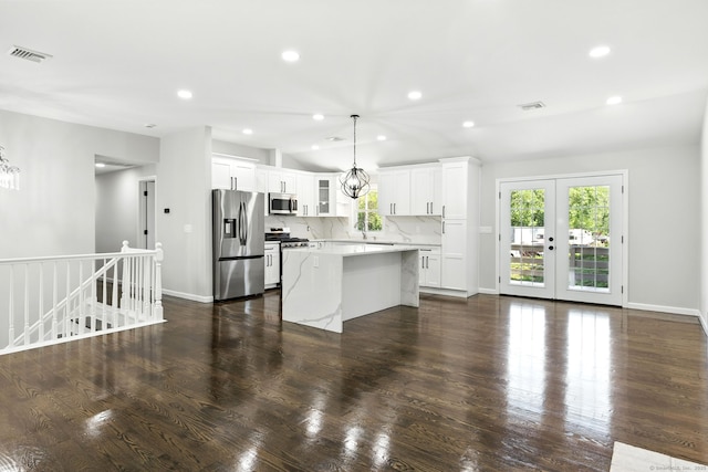 15 Beech St, North Branford, CT 06471 - kitchen with stainless steel appliances, plenty of natural light, a center island, white cabinets, and recessed lighting