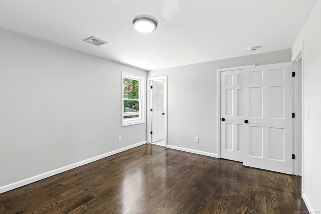 15 Beech St, North Branford, CT 06471 - unfurnished bedroom with dark wood finished floors and a closet
