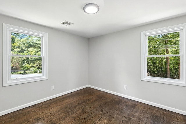 15 Beech St, North Branford, CT 06471 - empty room featuring plenty of natural light and dark wood finished floors