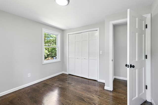 15 Beech St, North Branford, CT 06471 - unfurnished bedroom with dark wood-style floors and a closet