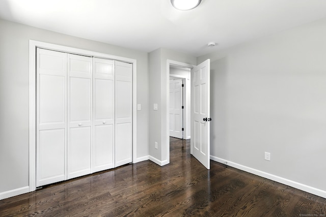 15 Beech St, North Branford, CT 06471 - unfurnished bedroom with a closet and dark wood-type flooring