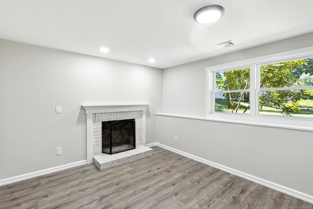 15 Beech St, North Branford, CT 06471 - unfurnished living room featuring a fireplace, wood finished floors, and recessed lighting