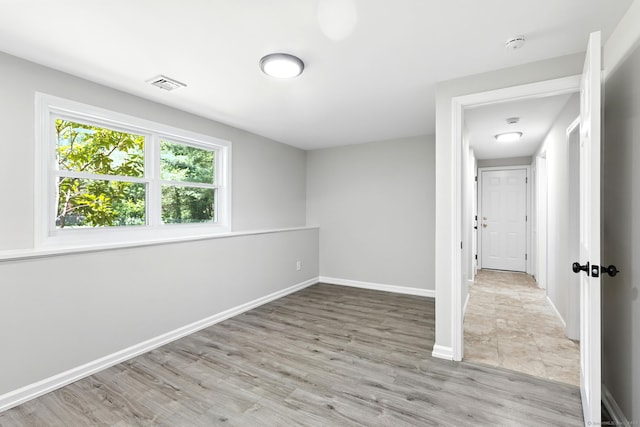 15 Beech St, North Branford, CT 06471 - empty room with a smoke detector and wood finished floors