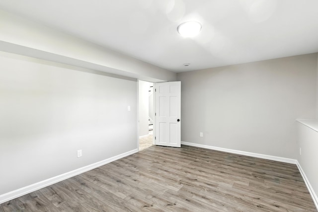 15 Beech St, North Branford, CT 06471 - empty room with wood finished floors and baseboards
