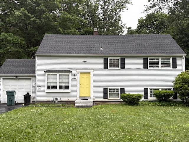13 Sheahan Dr, Hamden, CT 06514 - view of front facade featuring a chimney, a garage, a front yard, asphalt driveway, and roof with shingles