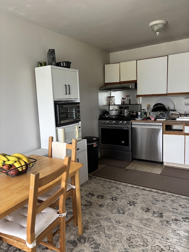 12 Cedar Ct Unit D, East Haven, CT 06513 - kitchen featuring stainless steel appliances, under cabinet range hood, and white cabinetry