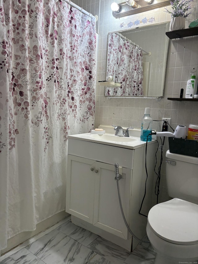 12 Cedar Ct Unit D, East Haven, CT 06513 - bathroom with tile walls, vanity, marble look tile flooring, and a shower with curtain