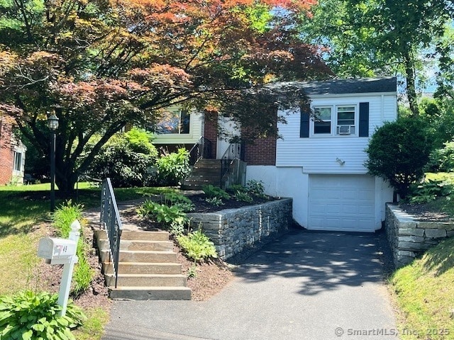 49 Geneva Ave, West Hartford, CT 06107 - obstructed view of property with driveway and a garage