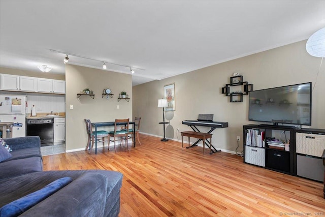 230 W Walk Walk Unit 230, West Haven, CT 06516 - living room with light wood-style floors, rail lighting, and ornamental molding
