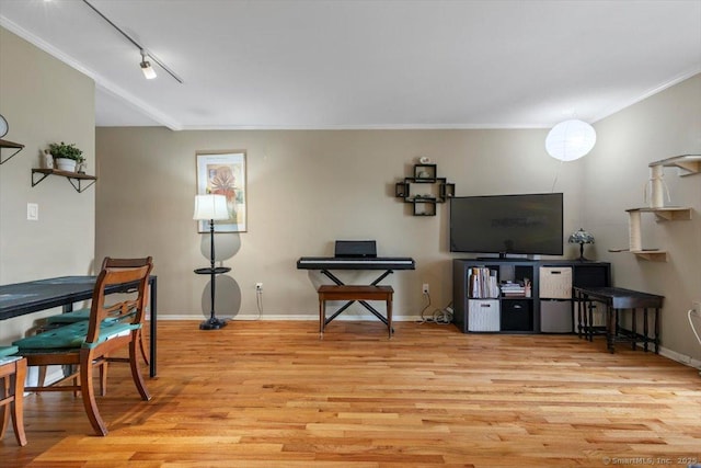 230 W Walk Walk Unit 230, West Haven, CT 06516 - living area featuring wood finished floors, ornamental molding, and rail lighting