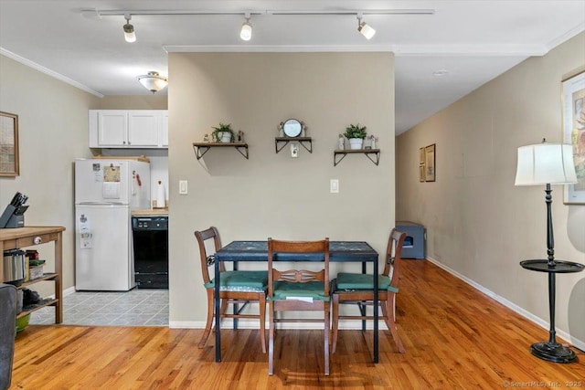 230 W Walk Walk Unit 230, West Haven, CT 06516 - dining area featuring light wood finished floors, track lighting, and ornamental molding