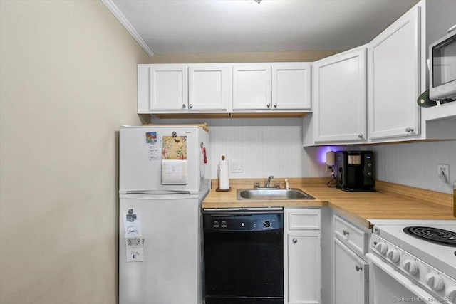 230 W Walk Walk Unit 230, West Haven, CT 06516 - kitchen with freestanding refrigerator, dishwasher, light countertops, white cabinetry, and ornamental molding