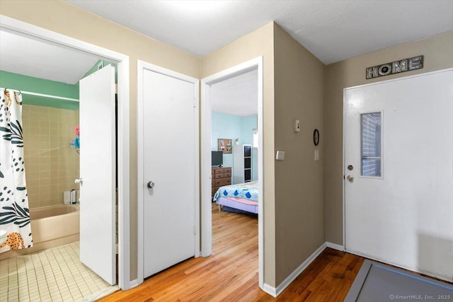 230 W Walk Walk Unit 230, West Haven, CT 06516 - foyer entrance featuring light wood-type flooring and baseboards