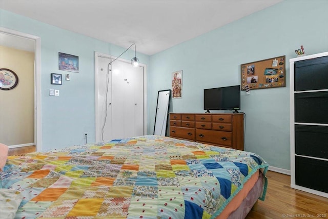 230 W Walk Walk Unit 230, West Haven, CT 06516 - bedroom with wood finished floors and baseboards