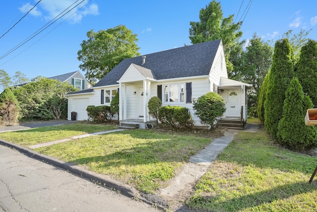 24 S Ave, Danbury, CT 06810 - view of front of house featuring a shingled roof, driveway, a front yard, and a garage