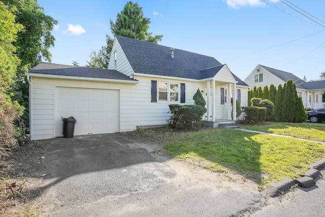 24 S Ave, Danbury, CT 06810 - view of front of house featuring roof with shingles, driveway, a garage, and a front yard