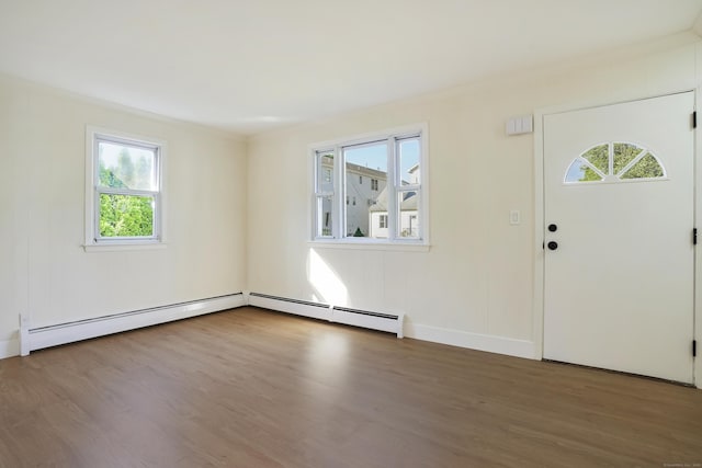24 S Ave, Danbury, CT 06810 - entryway with wood finished floors, baseboard heating, and ornamental molding