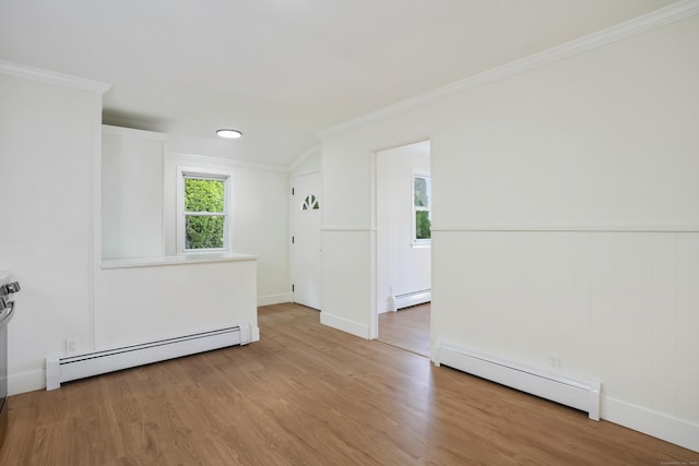 24 S Ave, Danbury, CT 06810 - empty room with a baseboard radiator, ornamental molding, and wood finished floors