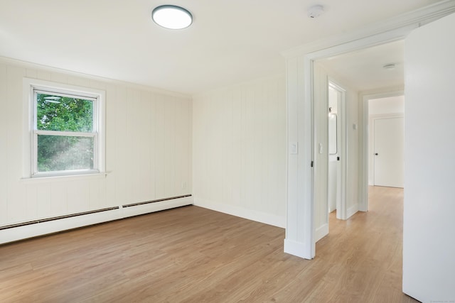24 S Ave, Danbury, CT 06810 - spare room featuring a baseboard heating unit, a smoke detector, and light wood-type flooring