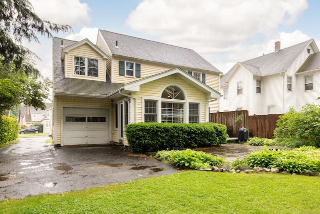 41 Northridge Ave, Torrington, CT 06790 - view of front facade with asphalt driveway, an attached garage, and a shingled roof