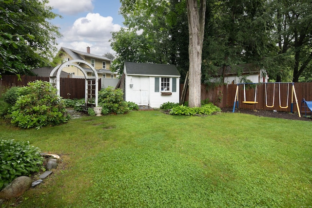 41 Northridge Ave, Torrington, CT 06790 - fenced backyard with a storage unit and a playground